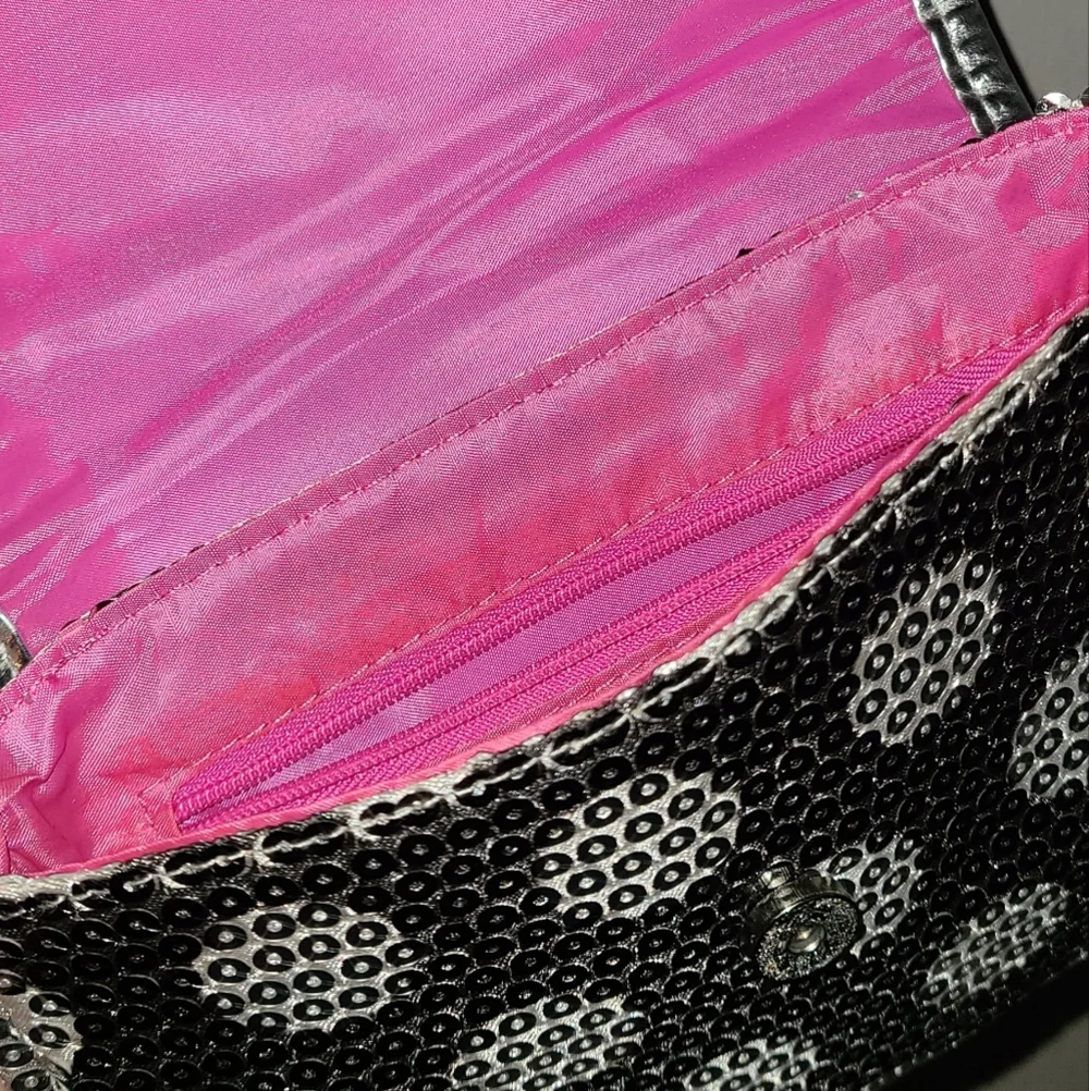 Sequins all over black and‎ silver poke a dots purse